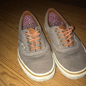 Grey vans with brown-orange lace